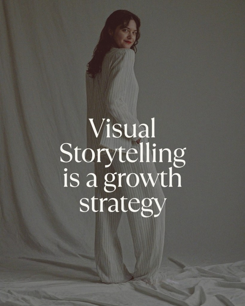 Editorial fashion portrait of Jenna Brooke  in a white pinstripe suit with the text overlay “Visual Storytelling is a Growth Strategy” on a minimalist fabric backdrop.