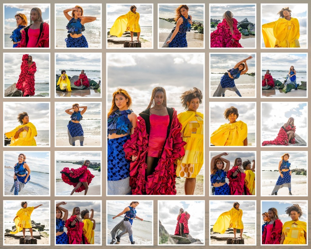 Editorial beach photoshoot featuring three models in vibrant red, yellow, and blue textured outfits, posing with flowing fabrics against a scenic shoreline backdrop.